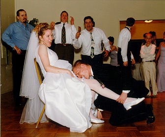 Groom garter toss brings single women out. #gartertoss #groomsman